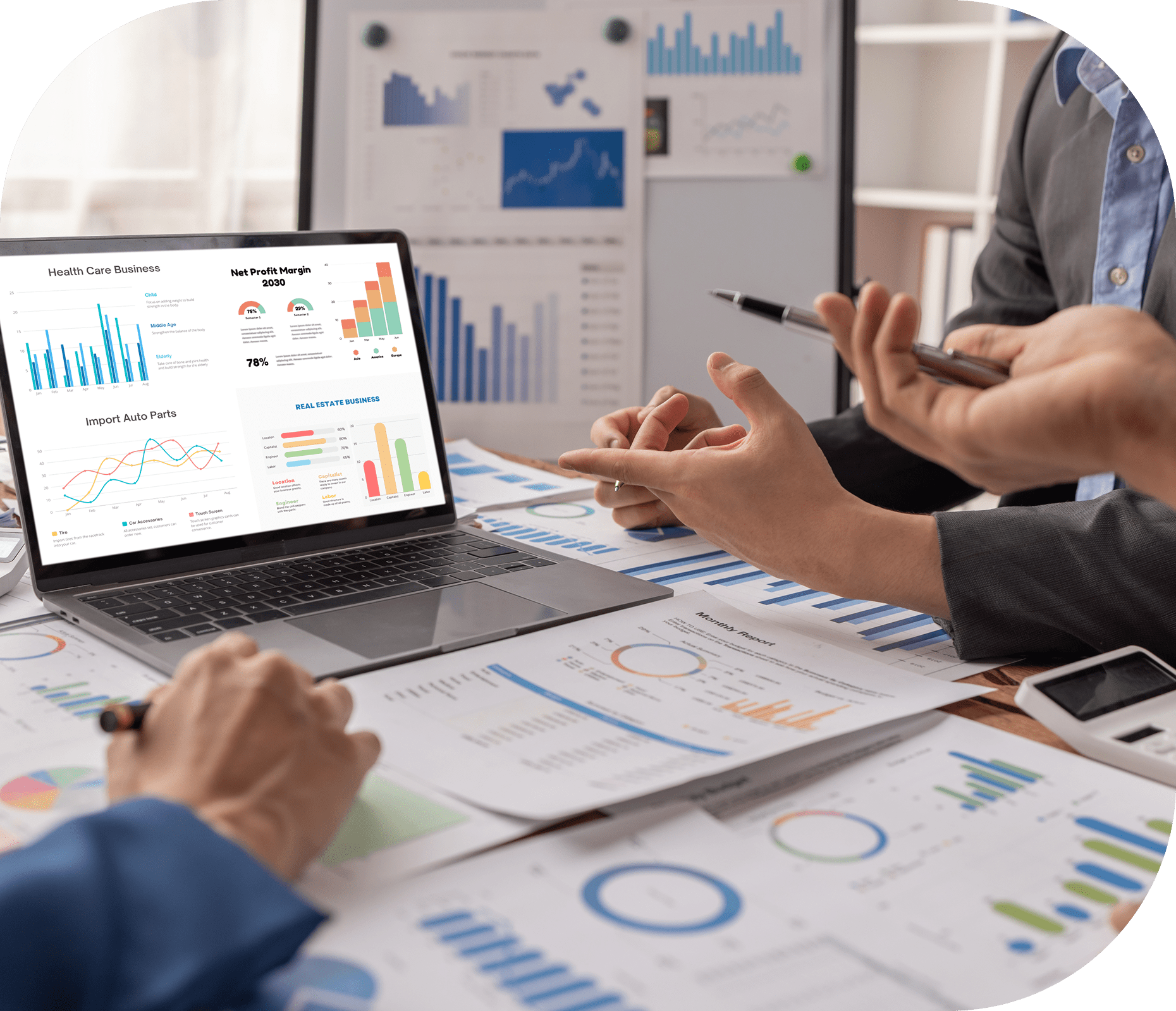 Business meeting with graphs and charts discussion.