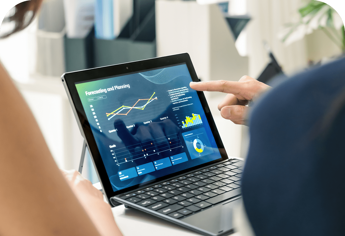 Person analyzing data on a tablet screen.
