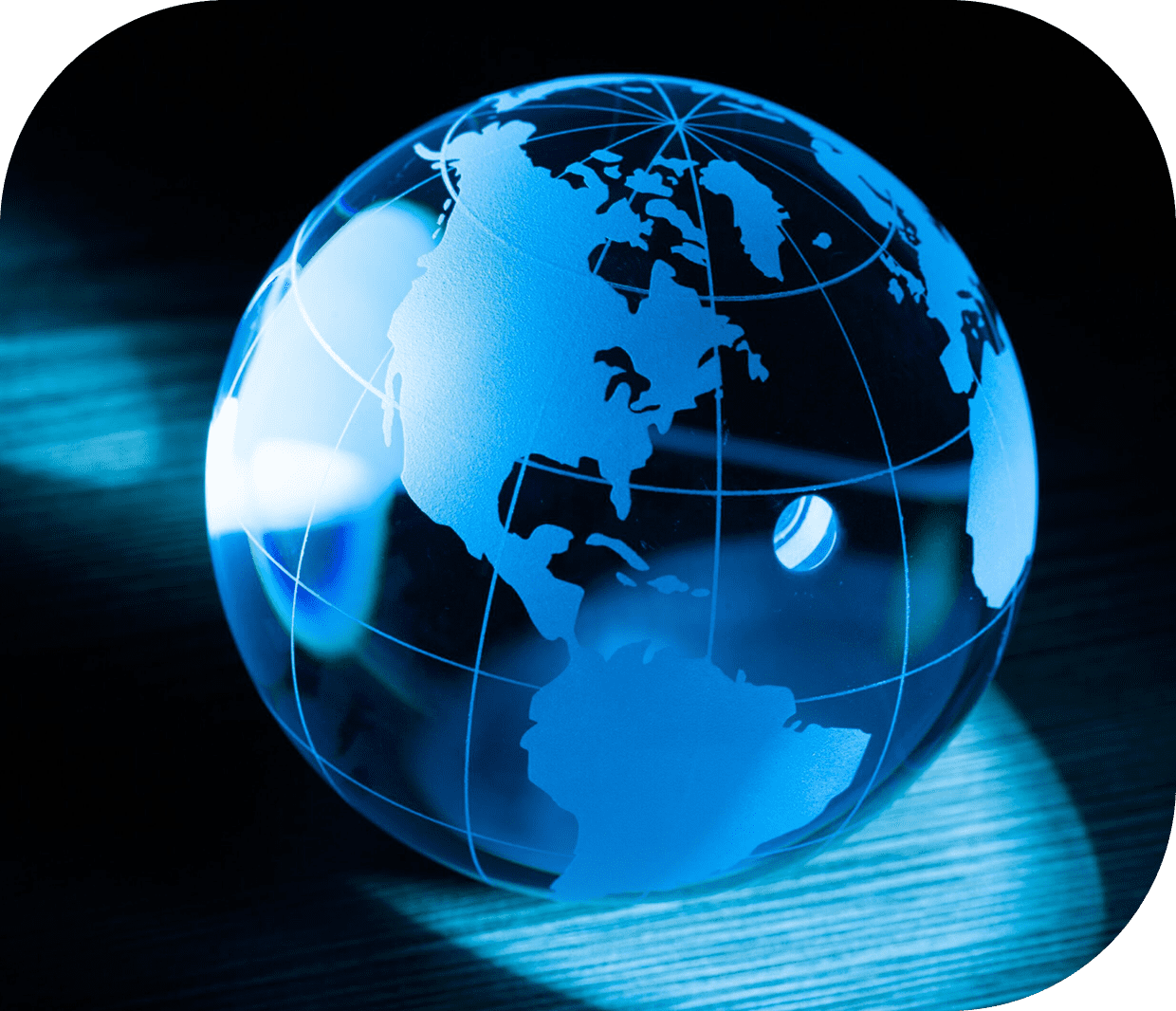 A glass globe is sitting on the ground.
